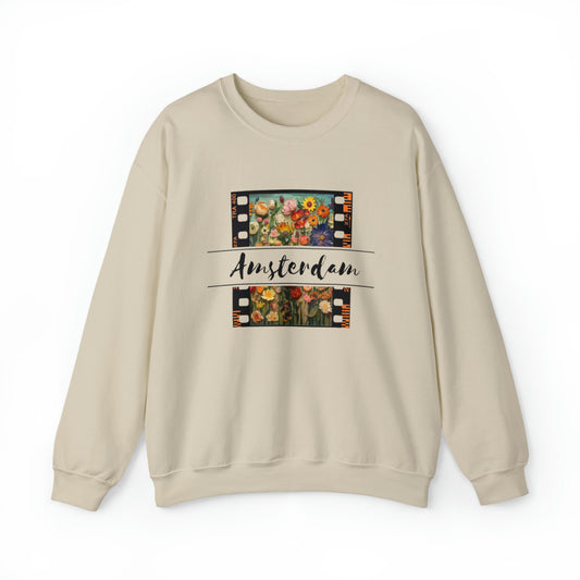 A beige sweatshirt with a graphic of colorful flowers and the word 'Amsterdam' on the front.