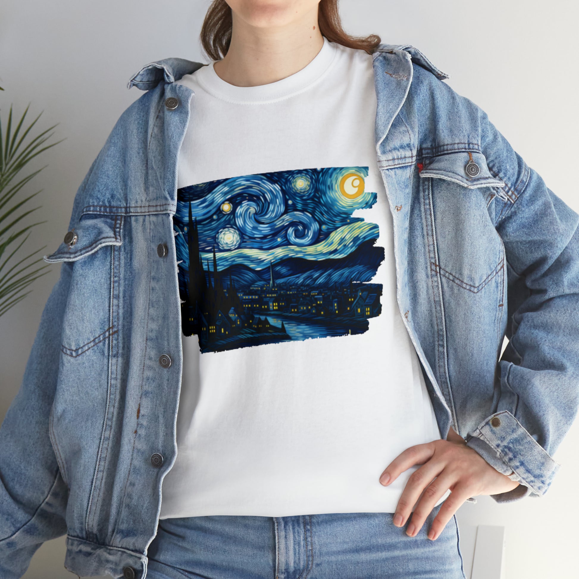 A person wearing a white t-shirt with a printed version of Vincent Van Gogh's 'The Starry Night' artwork on it.